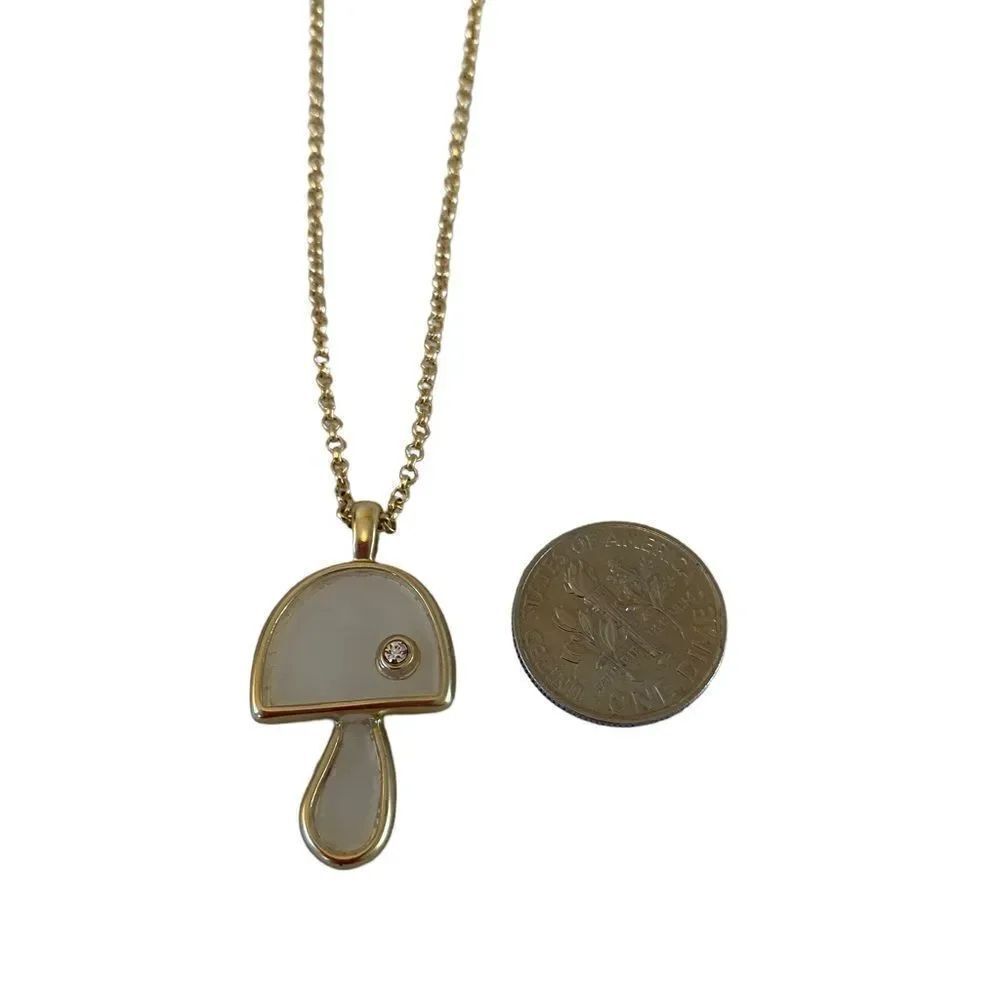 Mother of Pearl Mushroom Gold Toned Pendant w/ Solitary Pave Crystal.